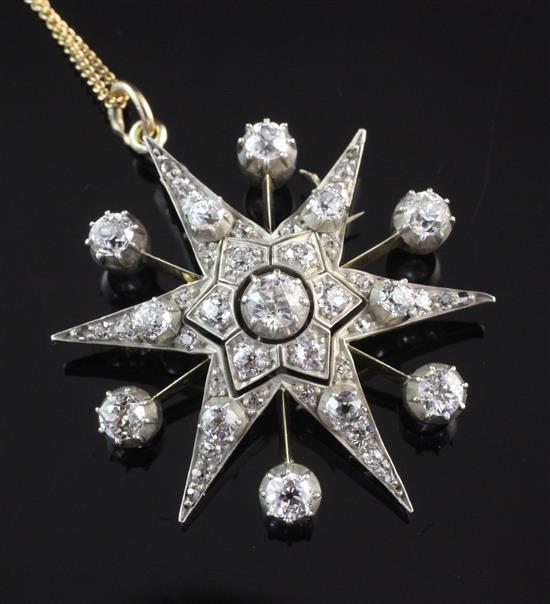 An early 20th century gold, silver and diamond star pendant brooch, pendant 1.75in.